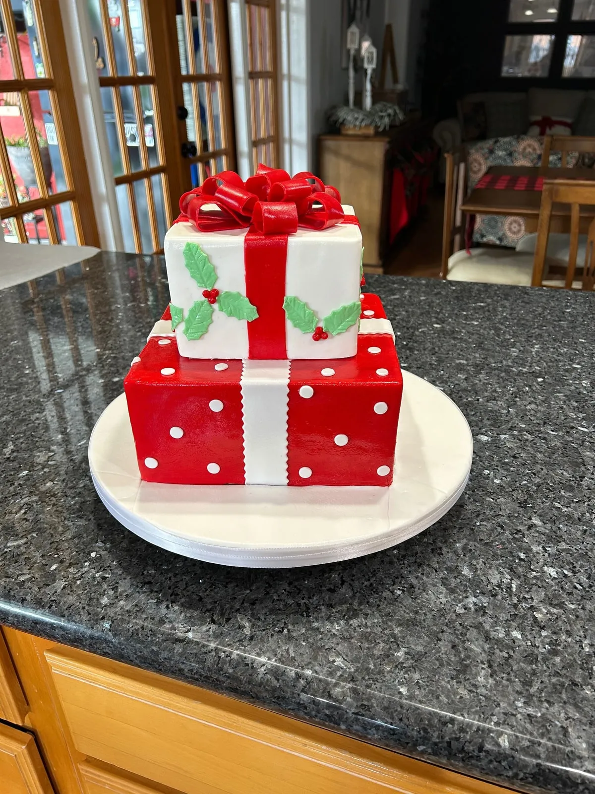 Sculpted stack of Christmas presents cake with fondant ribbons and bows