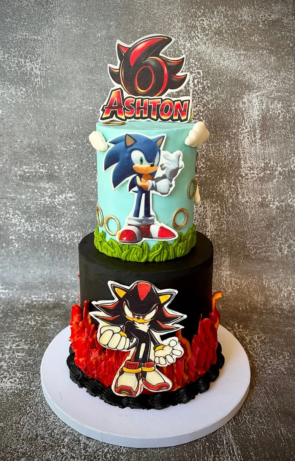 Two tier Sonic and Shadow birthday cake with hand cut figures and flame detail