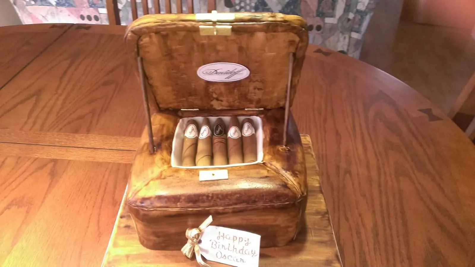 Sculpted treasure chest cake with a hinged fondant lid and satin interior