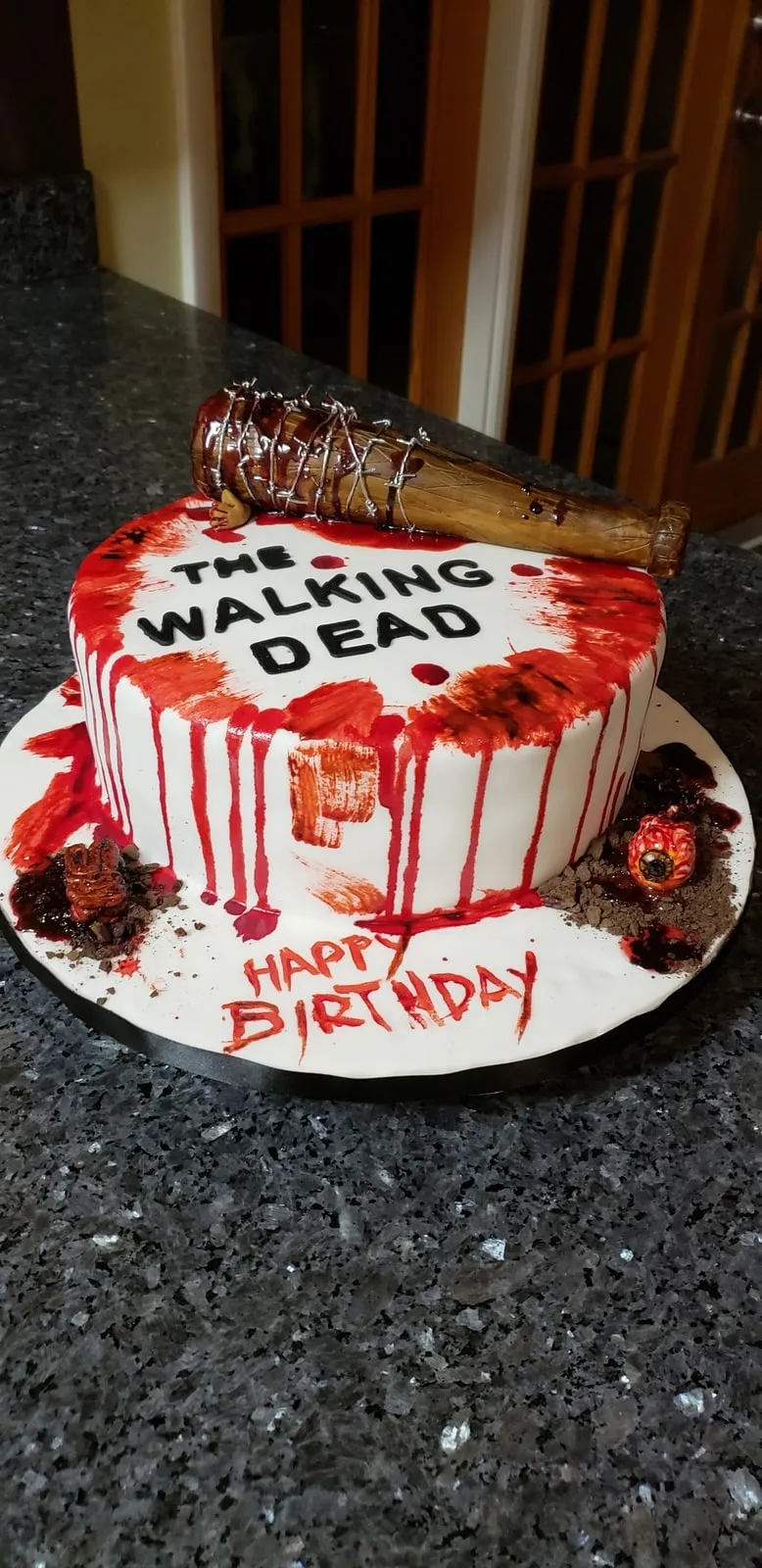 Horror themed birthday cake with red drip and hand modelled figures
